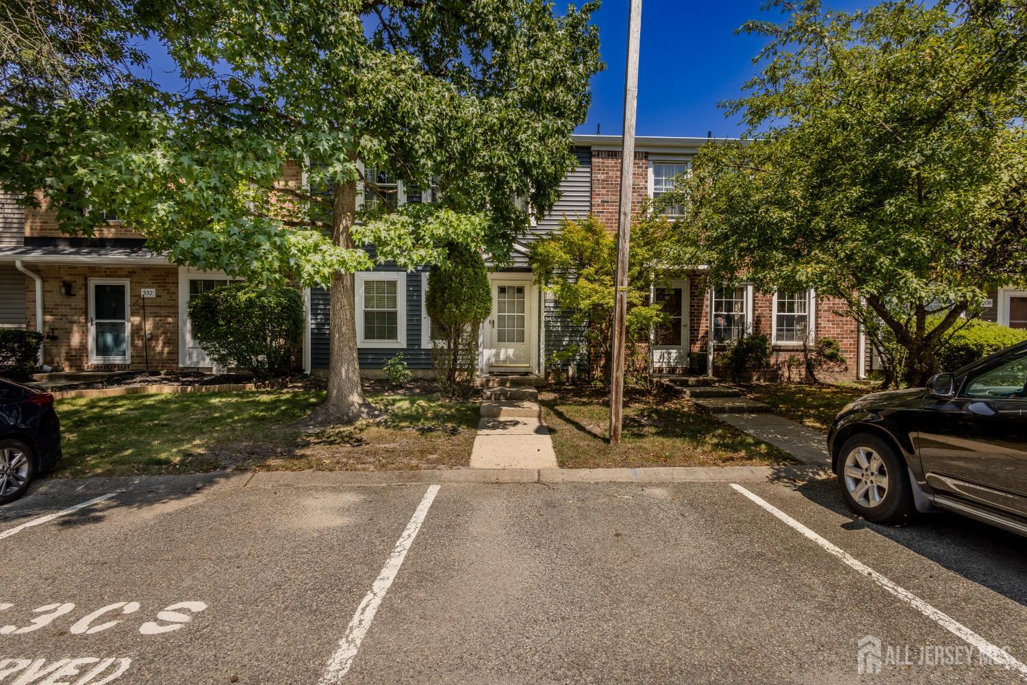 a row of car parked in front of house