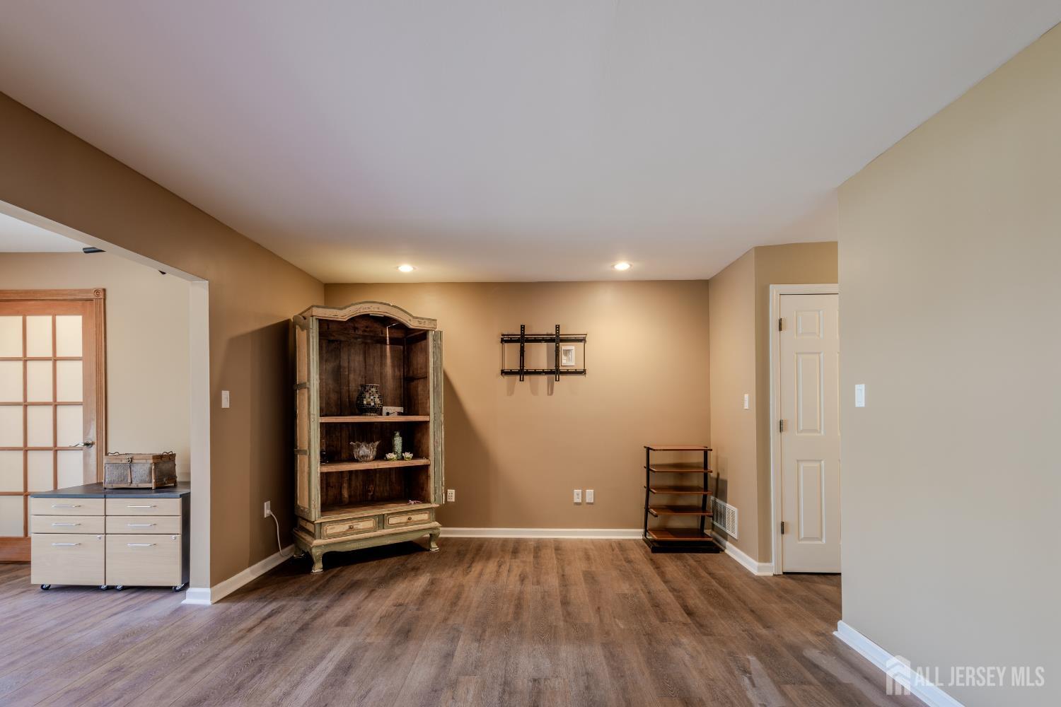 334 Constitution Circle North Brunswick, NJ 08902 - Photo 18 of 42 an empty room with wooden floor closet and windows