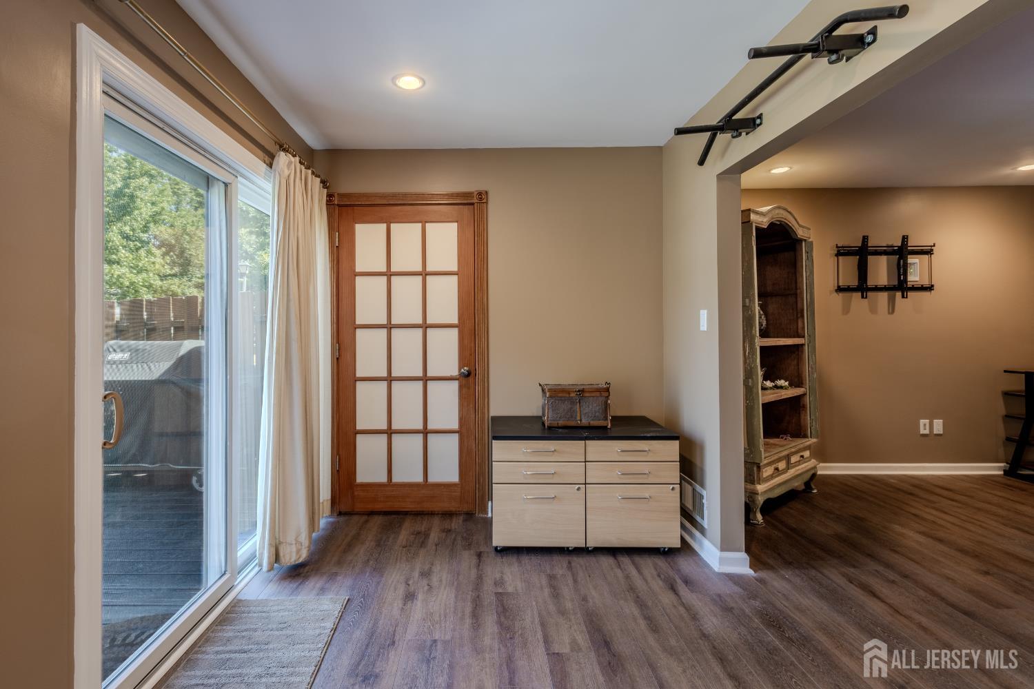334 Constitution Circle North Brunswick, NJ 08902 - Photo 22 of 42 a view of a hallway with wooden floor and cabinet