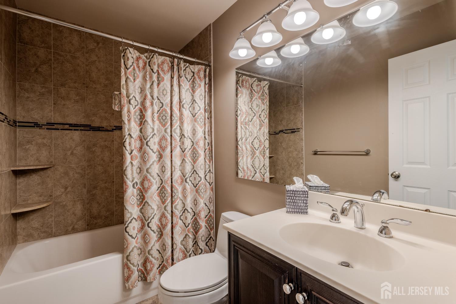 334 Constitution Circle North Brunswick, NJ 08902 - Photo 27 of 42 a bathroom with a sink toilet and shower