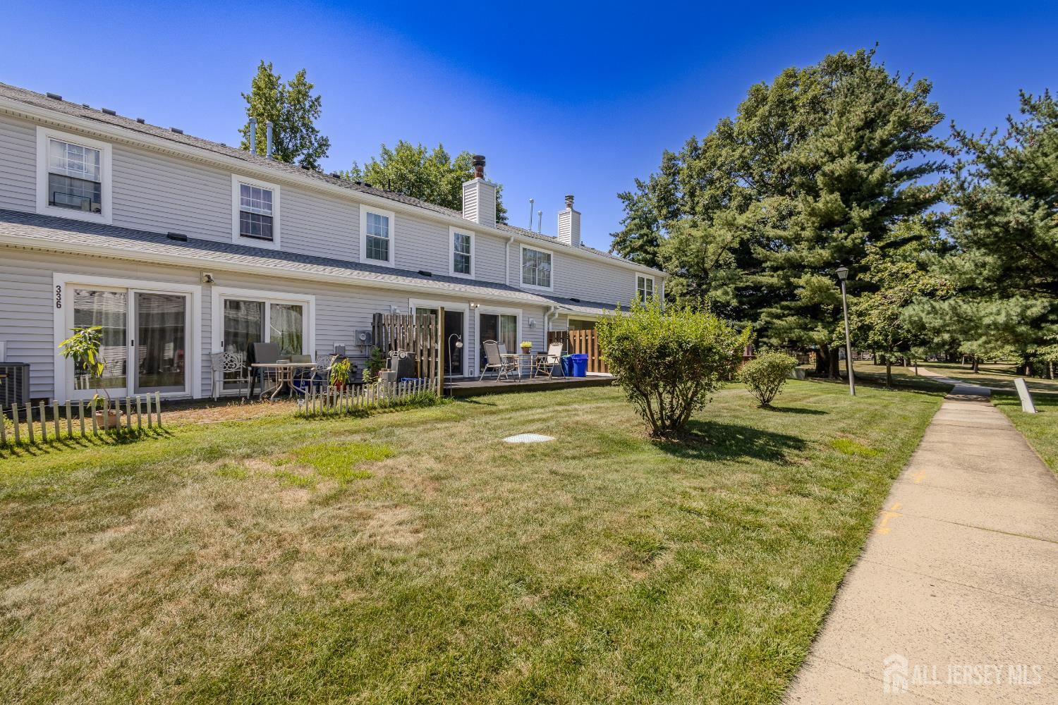 334 Constitution Circle North Brunswick, NJ 08902 - Photo 37 of 42 a swimming pool view with a seating space and a garden view