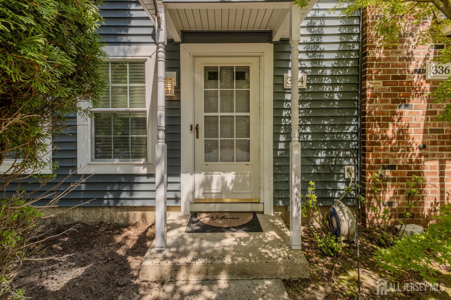 334 Constitution Circle North Brunswick, NJ 08902 - Photo 4 of 42 a view of a brick house with large windows