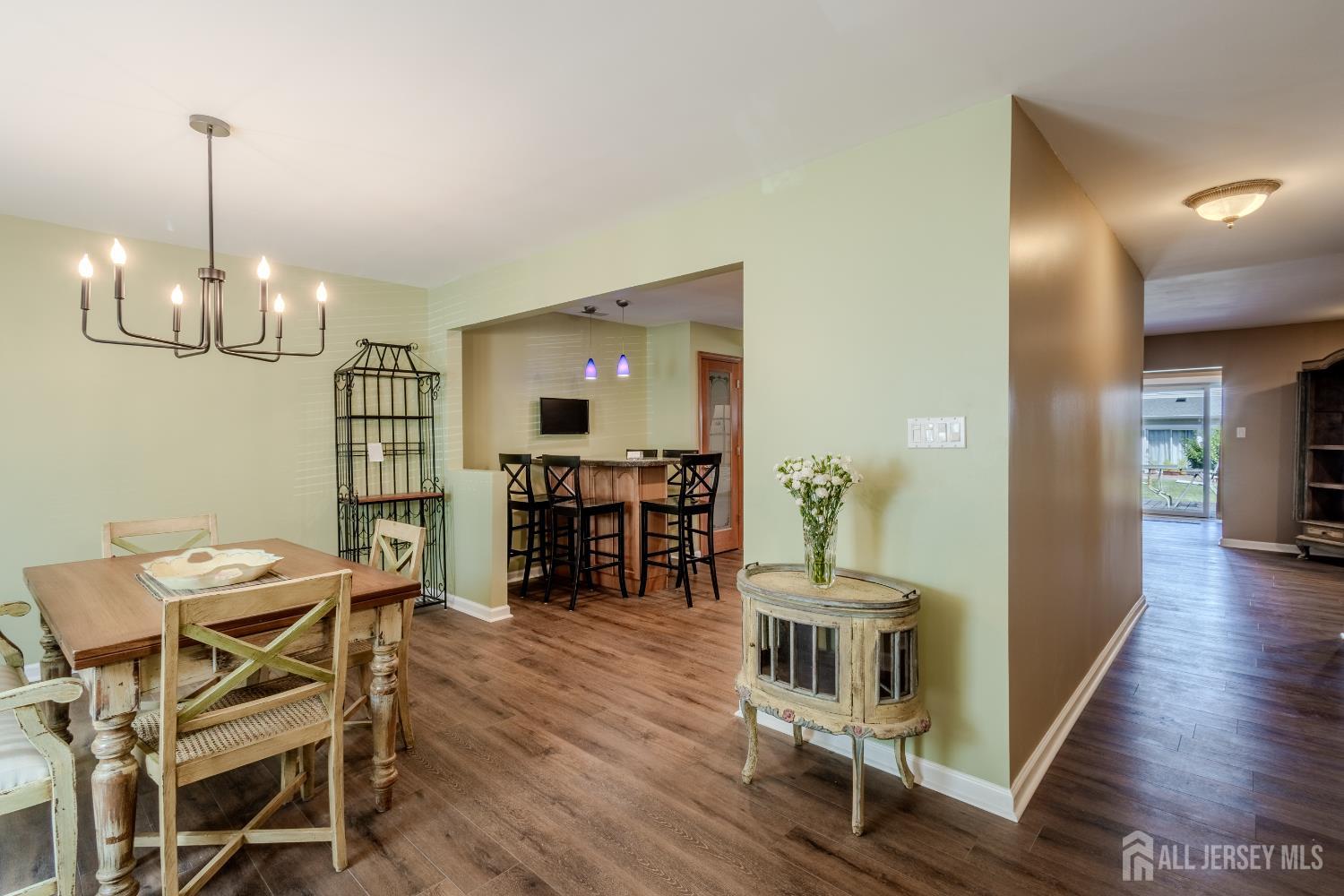 334 Constitution Circle North Brunswick, NJ 08902 - Photo 6 of 42 a view of a dining room with furniture and wooden floor