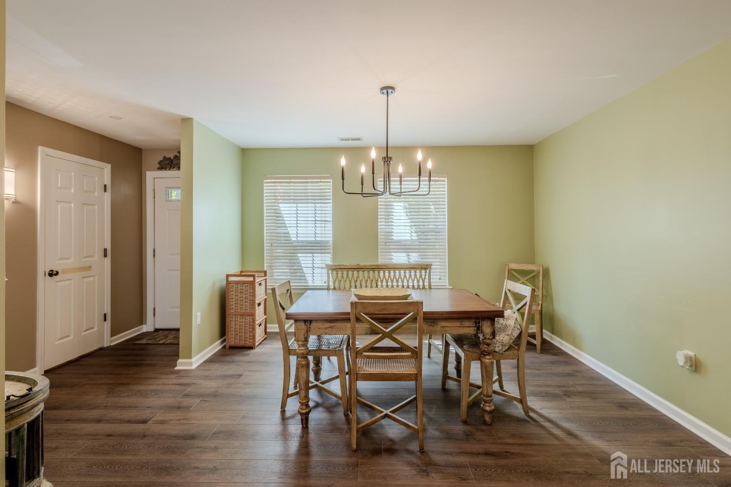 334 Constitution Circle North Brunswick, NJ 08902 - Photo 8 of 42 a view of a dining room with furniture window and wooden floor
