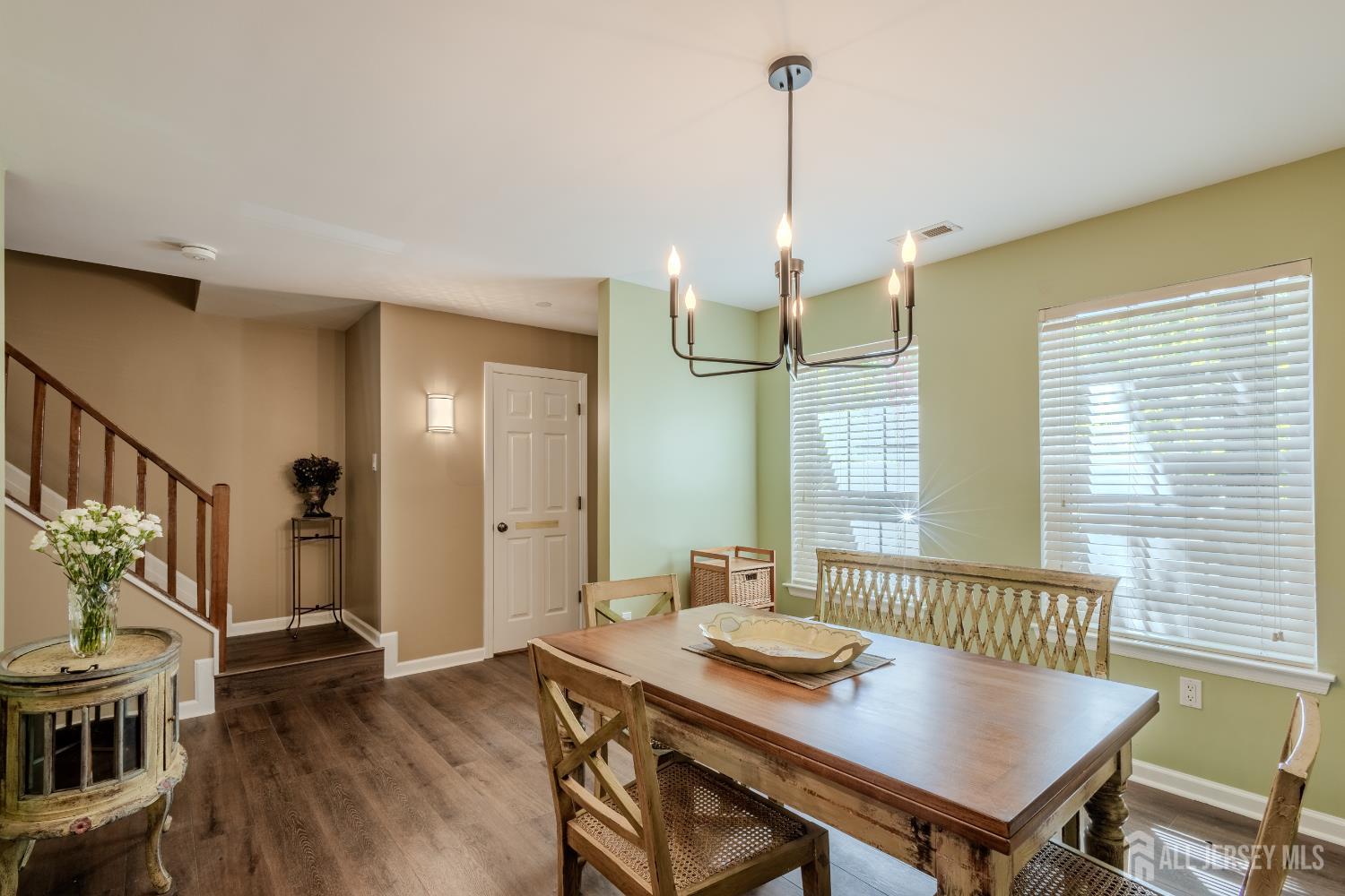 334 Constitution Circle North Brunswick, NJ 08902 - Photo 9 of 42 a view of a dining room with furniture window and wooden floor