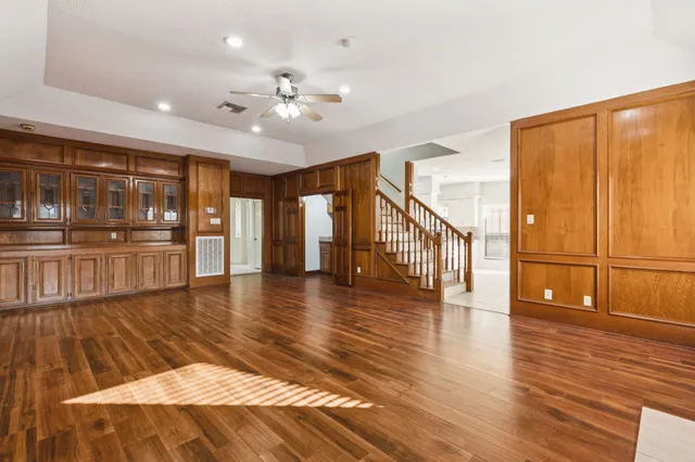 a view of an entryway with wooden floor