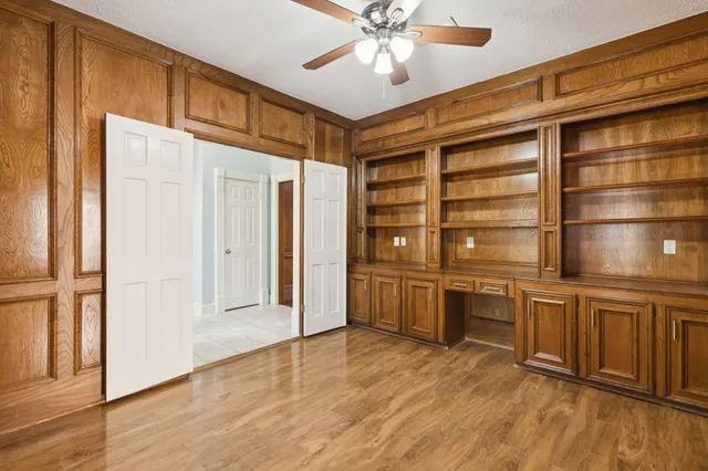 a view of a kitchen with a sink and cabinets