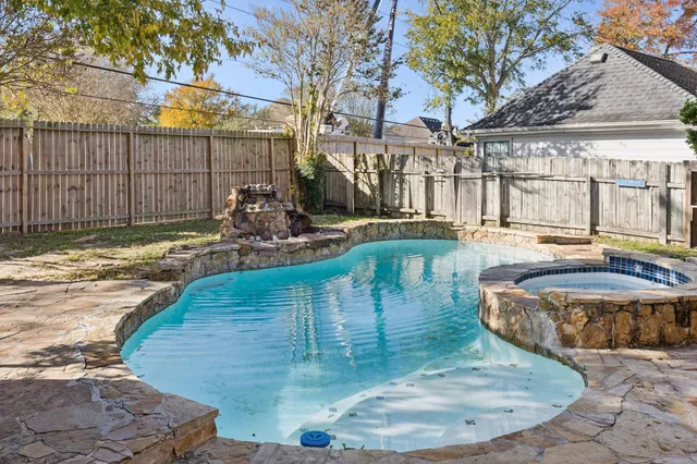 a view of a swimming pool with an outdoor space