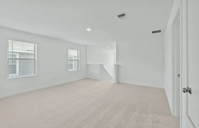 a view of an empty walk in closet with empty racks