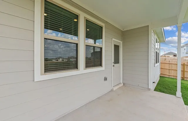 a view of a lake with houses in the back