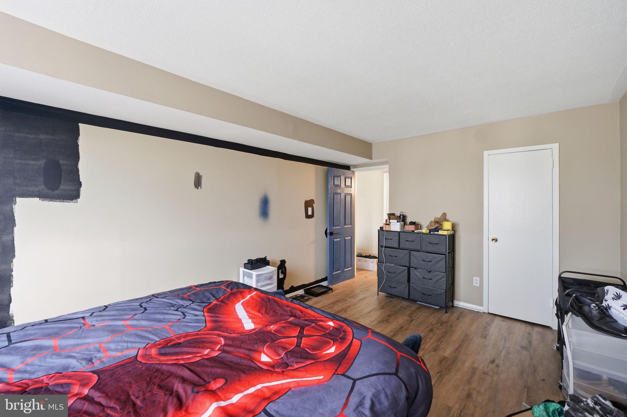1836 Metzerott Road, Unit 904 Hyattsville, MD 20783 - Photo 13 of 37 a bedroom with a bed and furniture