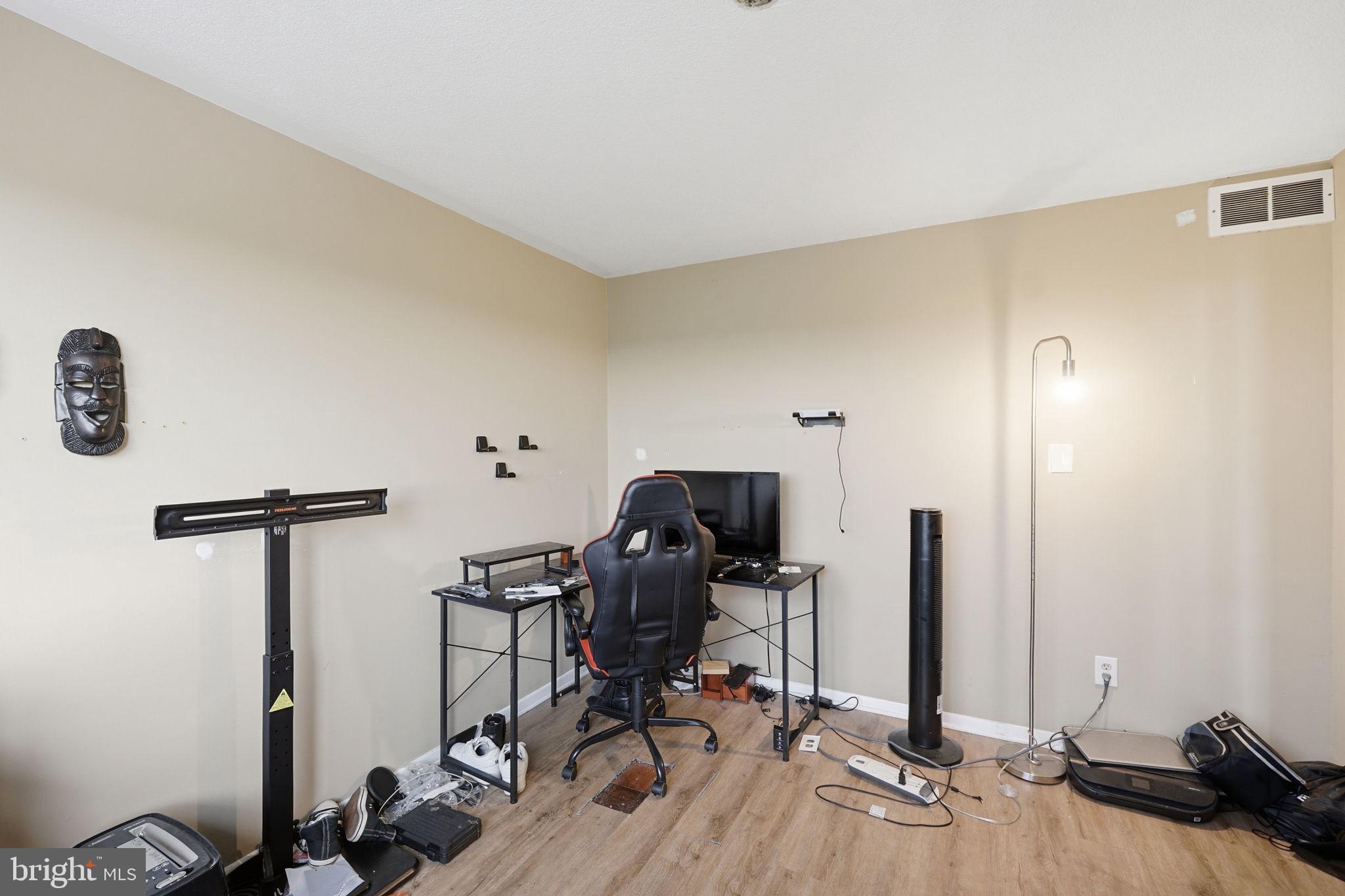 1836 Metzerott Road, Unit 904 Hyattsville, MD 20783 - Photo 16 of 37 a view of a workspace with furniture and gym equipment