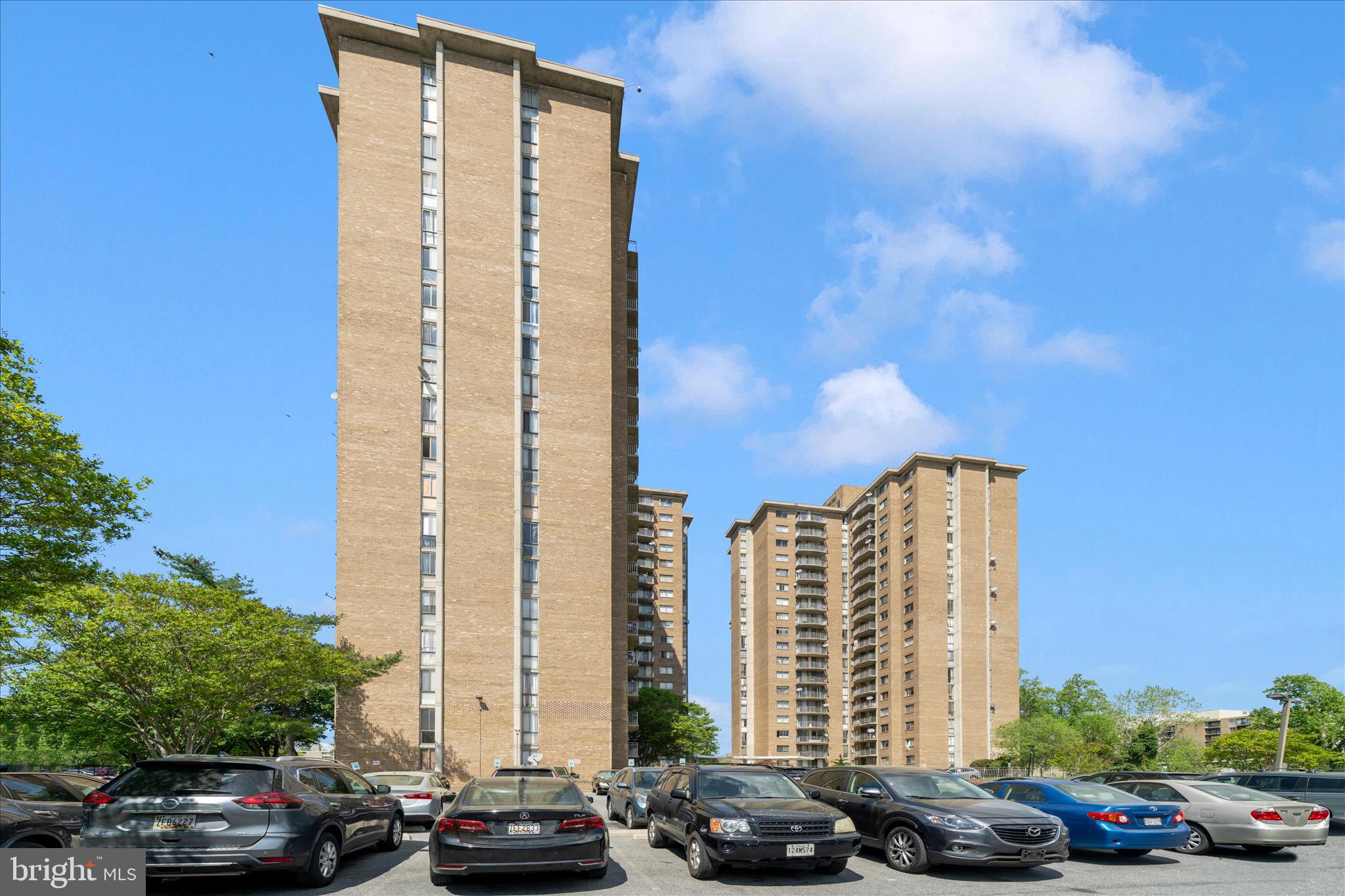 1836 Metzerott Road, Unit 904 Hyattsville, MD 20783 - Photo 25 of 37 a city view with tall buildings and cars parked on road