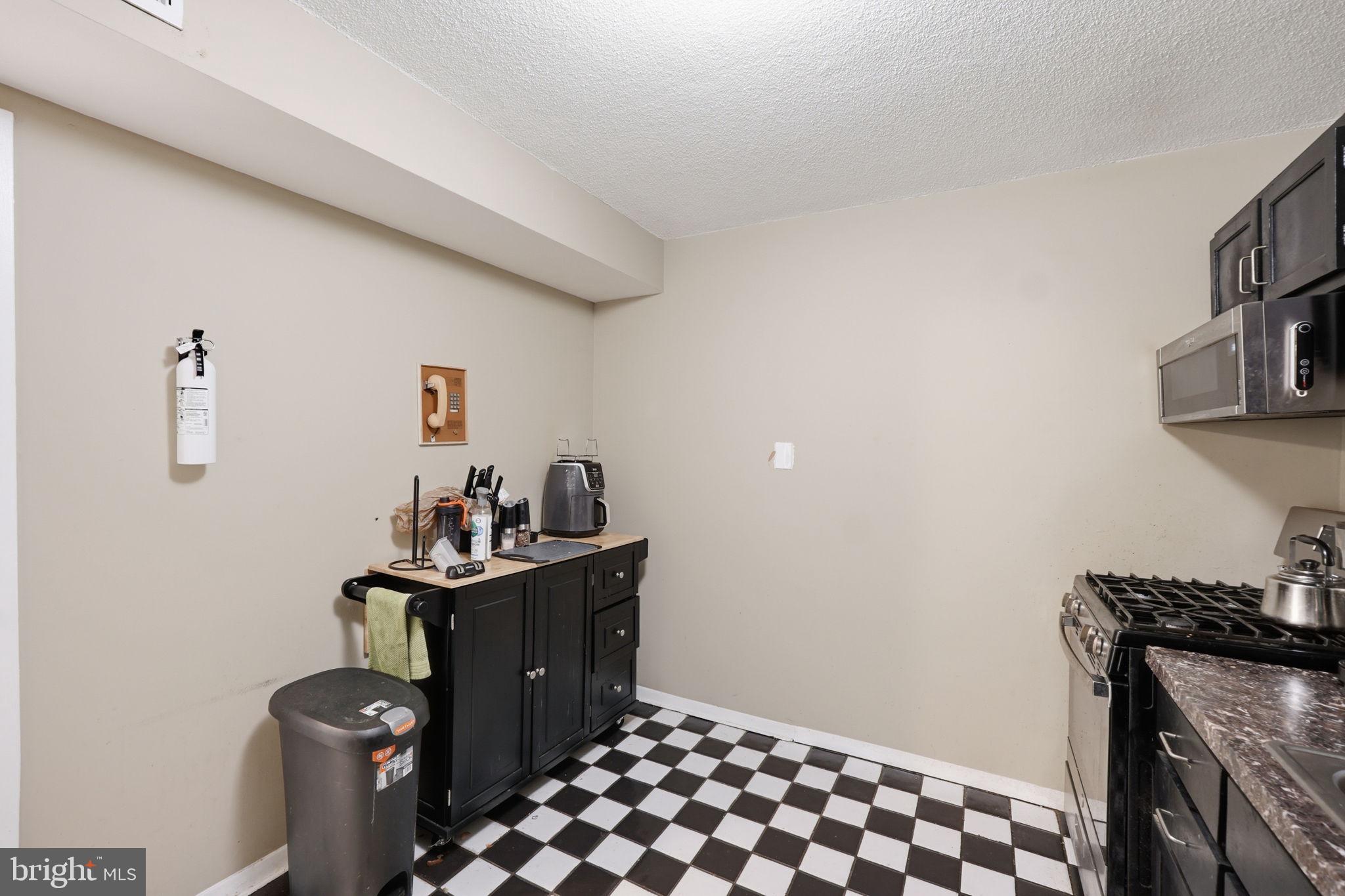 1836 Metzerott Road, Unit 904 Hyattsville, MD 20783 - Photo 9 of 37 a room with a washer and dryer