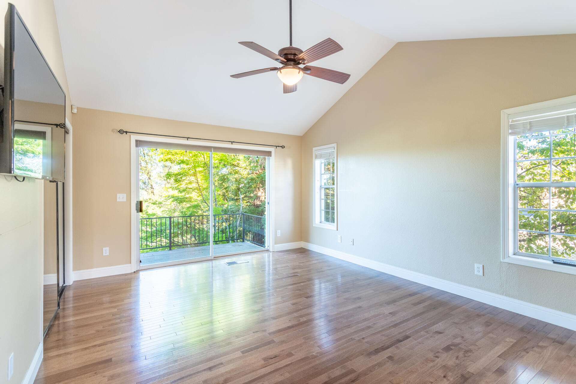 3126 Riesling Path Redding, CA 96001 - Photo 13 of 32 a view of an empty room with wooden floor and a window