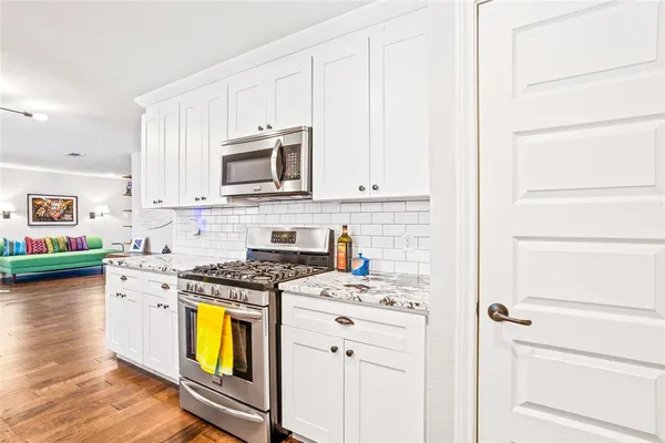 a kitchen with a sink and a window