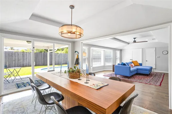 a view of a dining room with a table and chairs