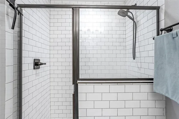 a bathroom with a granite countertop sink mirror vanity and toilet
