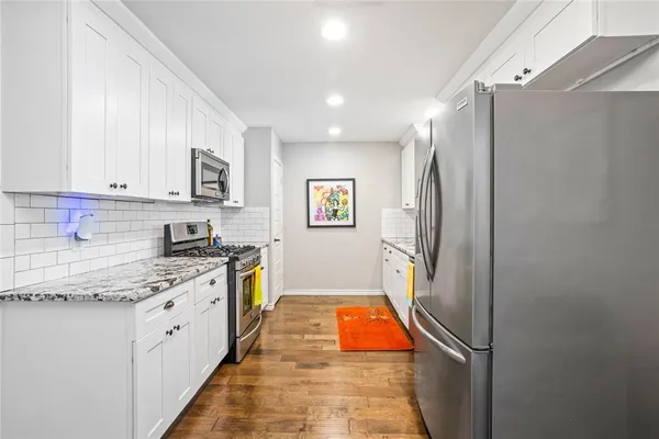 a view of a living room and dining room