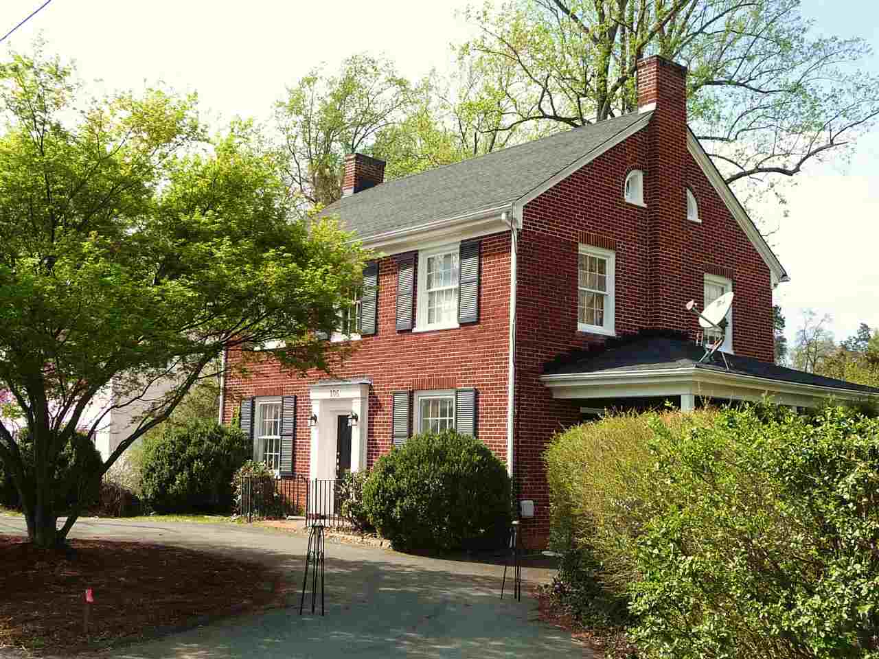 106 Minor Road Charlottesville, VA 22903 - Photo 1 of 9 a front view of house with yard and trees in the background