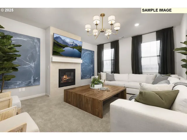 a living room with furniture a fireplace and a chandelier