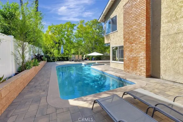 a view of a backyard with sitting area