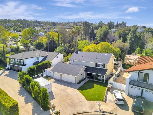 an aerial view of a house with a garden