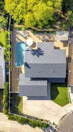 a view of a house with yard and lake view