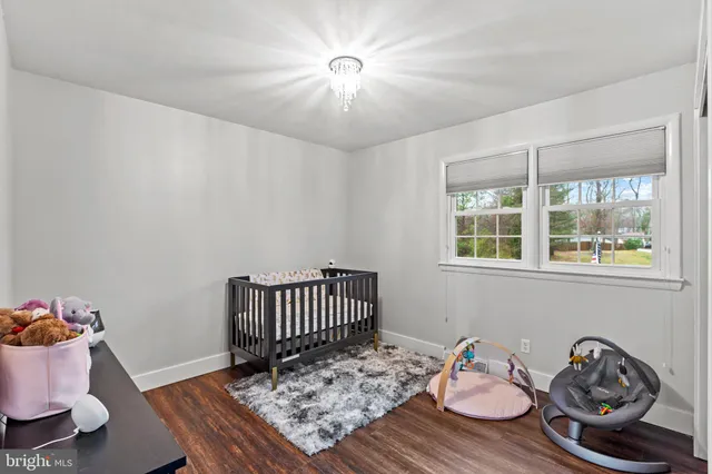 a view of a room that has a table and chairs