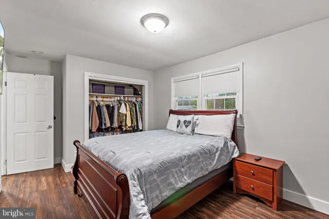 a bedroom with a bed and a closet