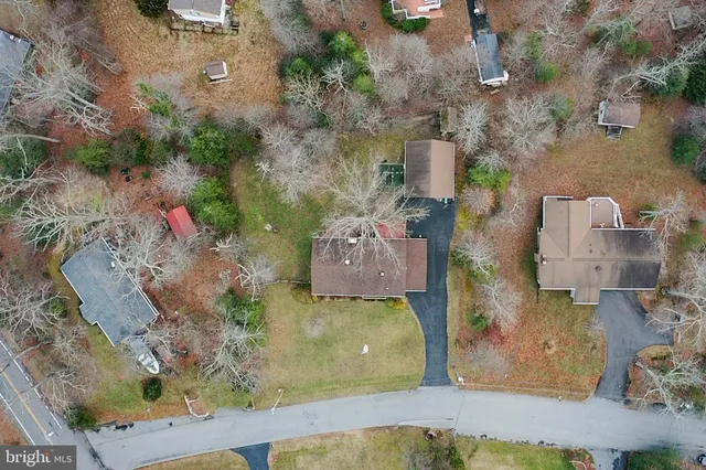 an aerial view of a house with outdoor space