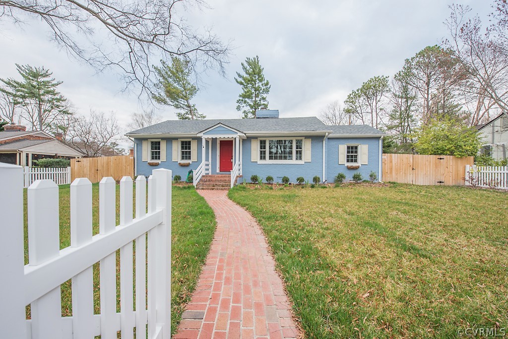8008 Dunsmore Road Henrico, VA 23229 - Photo 2 of 46 a front view of house with yard and trees around