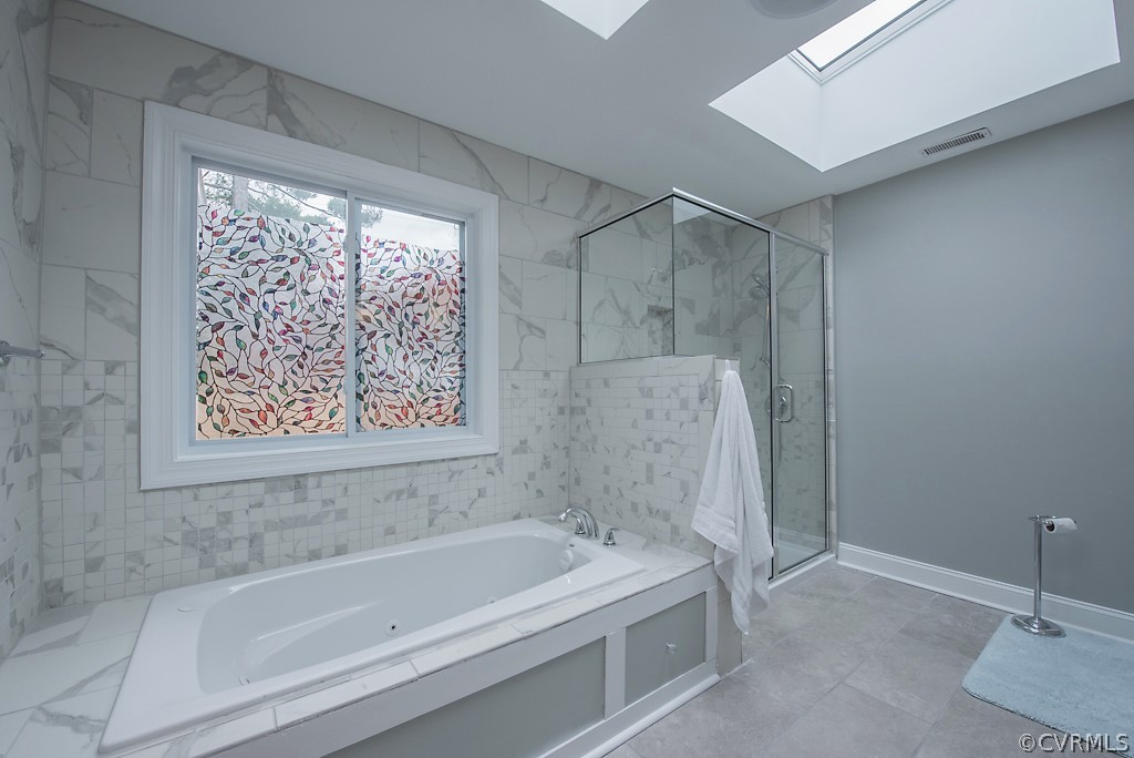 8008 Dunsmore Road Henrico, VA 23229 - Photo 33 of 46 a white bath tub sitting next to a shower