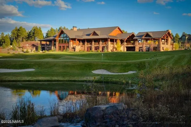 a front view of a house with a yard table and chairs