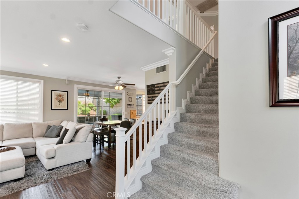 2702 Titania Place Simi Valley, CA 93063 - Photo 16 of 38 a living room with furniture and stairs