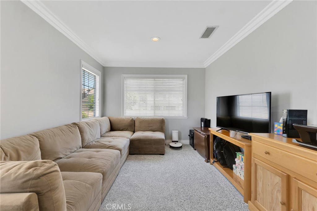 2702 Titania Place Simi Valley, CA 93063 - Photo 18 of 38 a living room with furniture and a flat screen tv