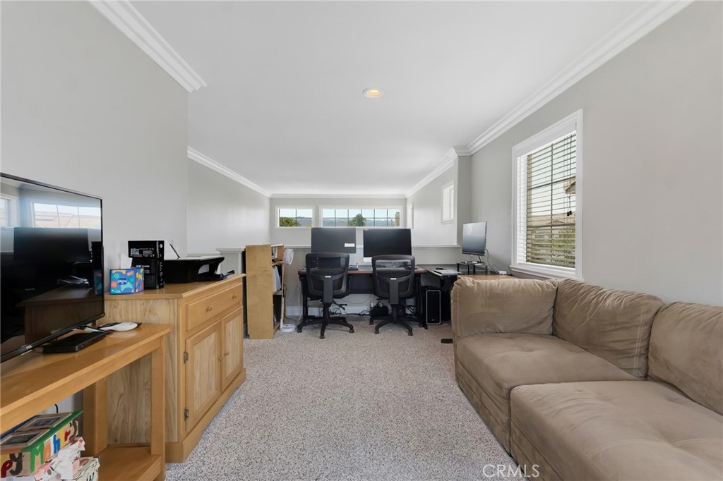 2702 Titania Place Simi Valley, CA 93063 - Photo 19 of 38 a living room with furniture and a flat screen tv