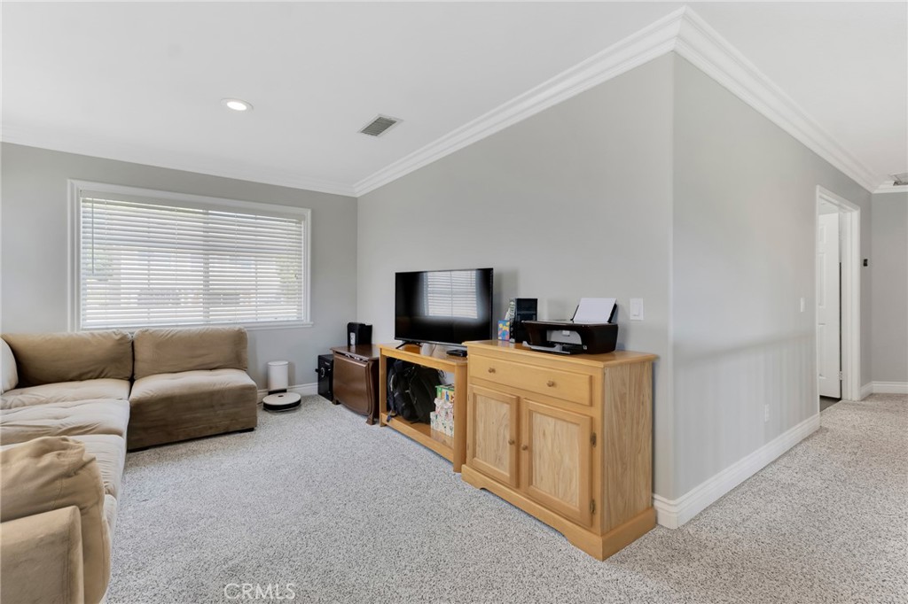 2702 Titania Place Simi Valley, CA 93063 - Photo 20 of 38 a bedroom with furniture and a flat screen tv
