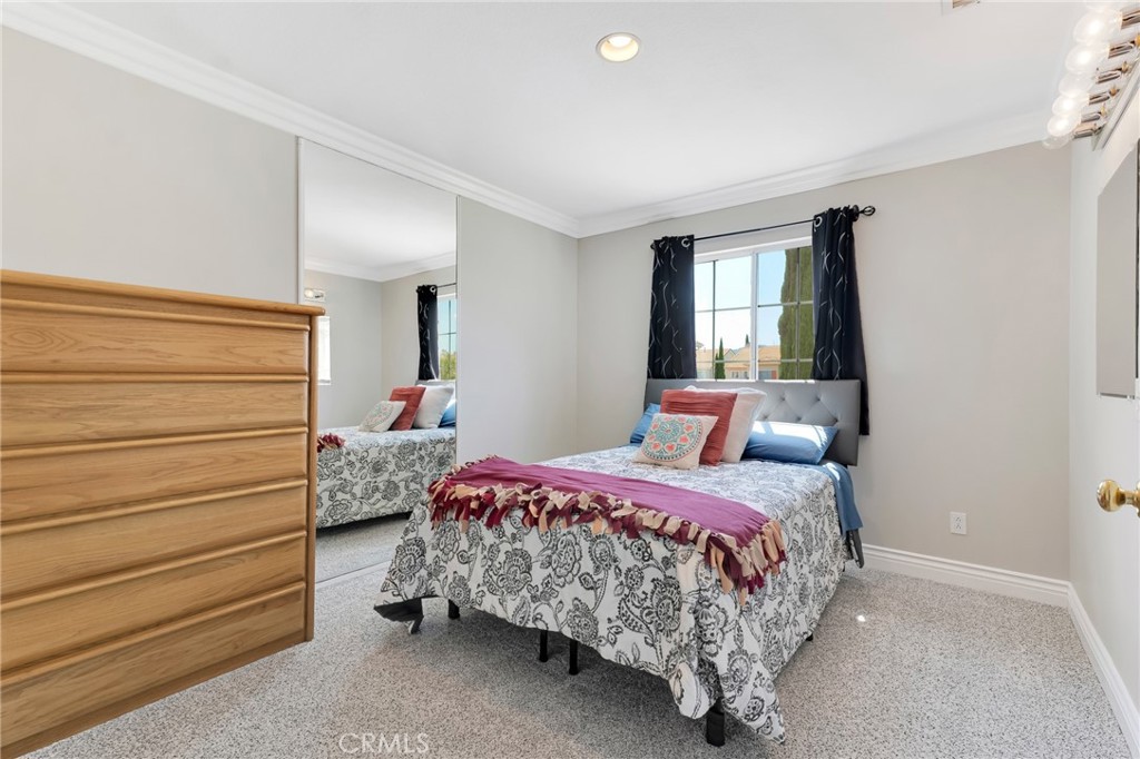 2702 Titania Place Simi Valley, CA 93063 - Photo 21 of 38 a bedroom with a bed and a window