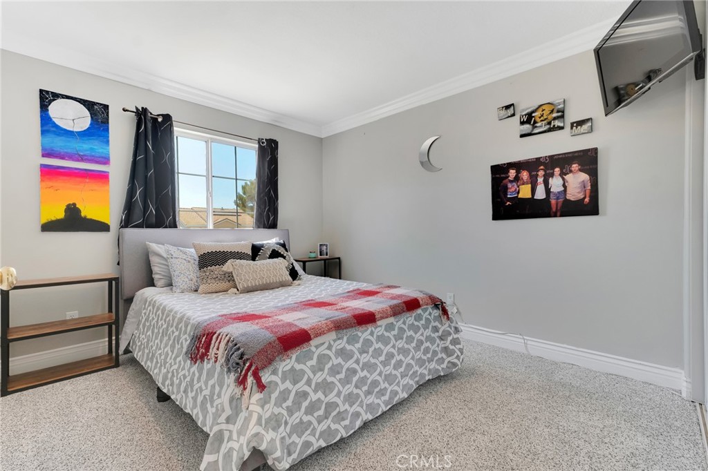 2702 Titania Place Simi Valley, CA 93063 - Photo 24 of 38 a bedroom with a bed and a window