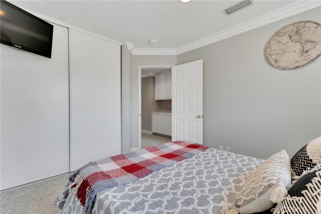 2702 Titania Place Simi Valley, CA 93063 - Photo 25 of 38 a bedroom with a bed and a flat screen tv