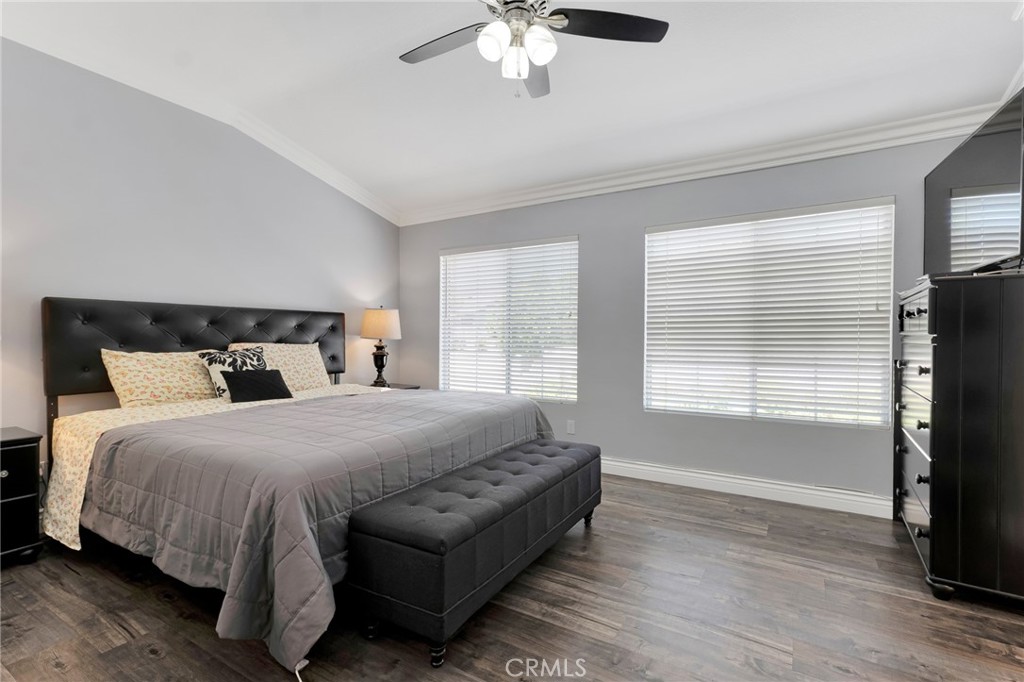 2702 Titania Place Simi Valley, CA 93063 - Photo 26 of 38 a spacious bedroom with a bed and a chandelier