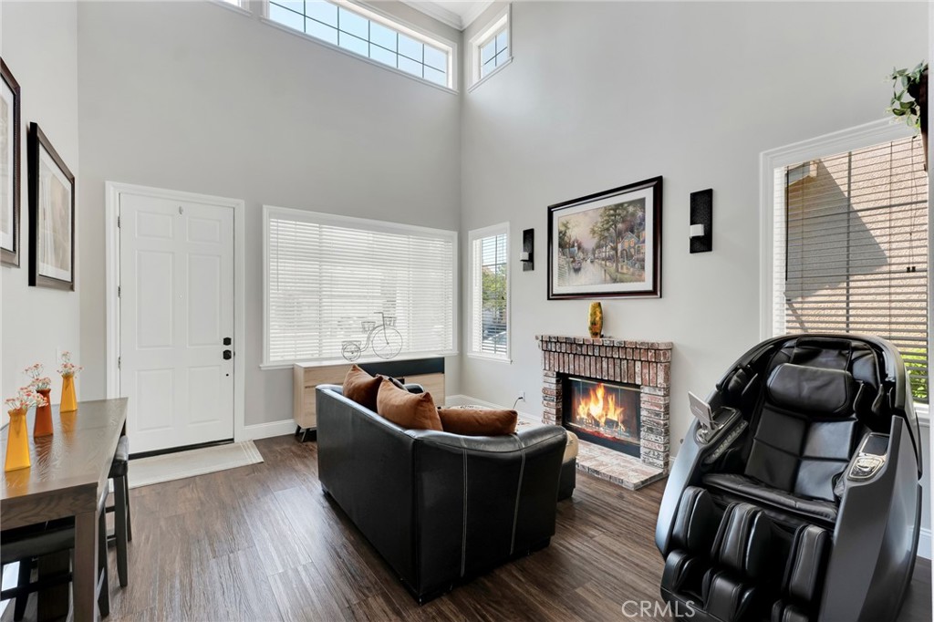 2702 Titania Place Simi Valley, CA 93063 - Photo 3 of 38 a living room with furniture and a fireplace