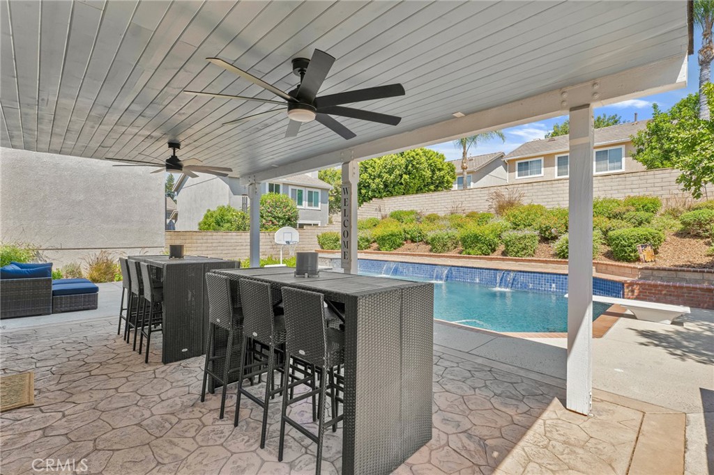 2702 Titania Place Simi Valley, CA 93063 - Photo 31 of 38 a view of a patio with table and chairs