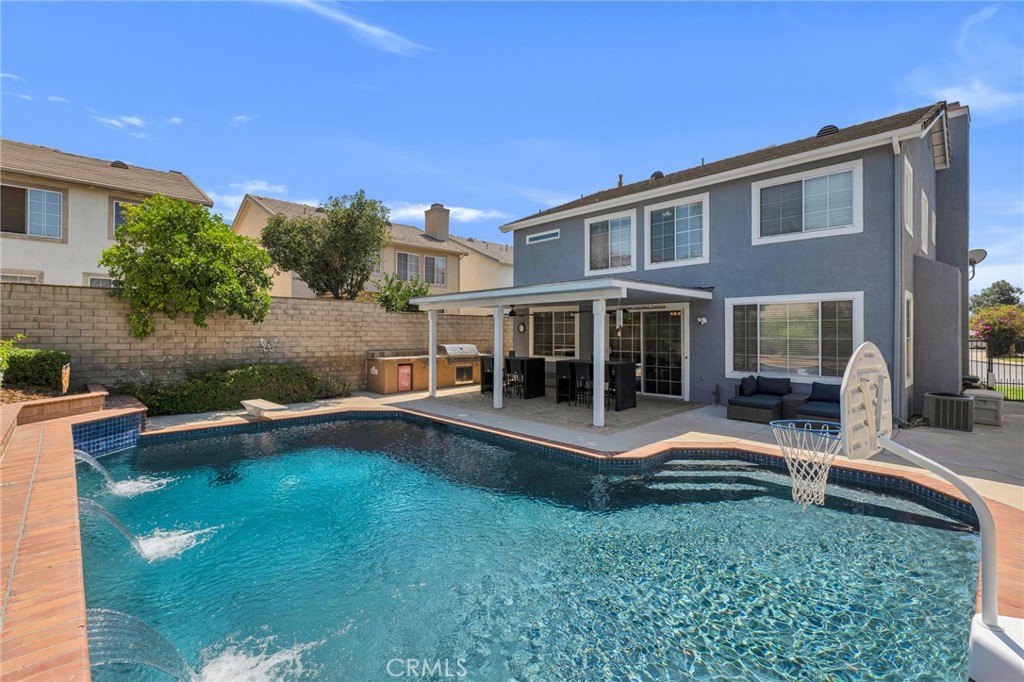 2702 Titania Place Simi Valley, CA 93063 - Photo 33 of 38 a view of a house with backyard sitting area and garden
