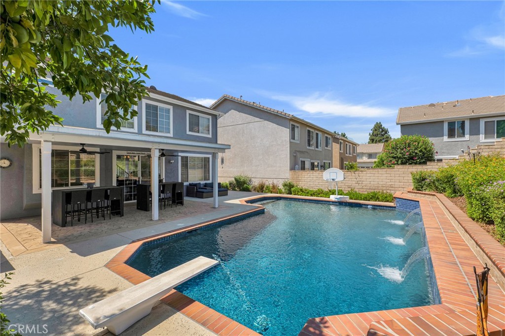 2702 Titania Place Simi Valley, CA 93063 - Photo 34 of 38 a view of house with swimming pool outdoor seating