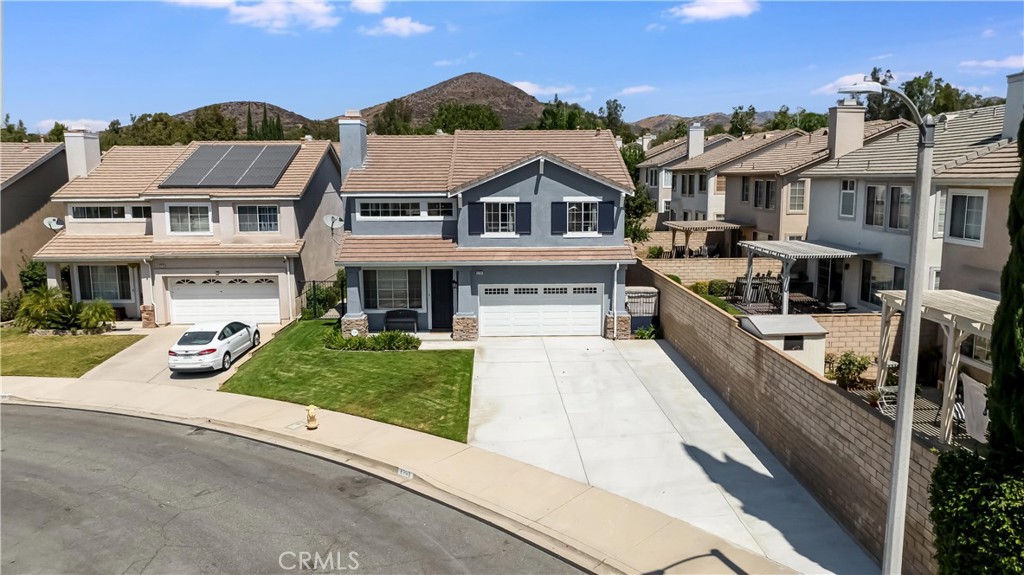 2702 Titania Place Simi Valley, CA 93063 - Photo 35 of 38 a front view of a residential houses with yard