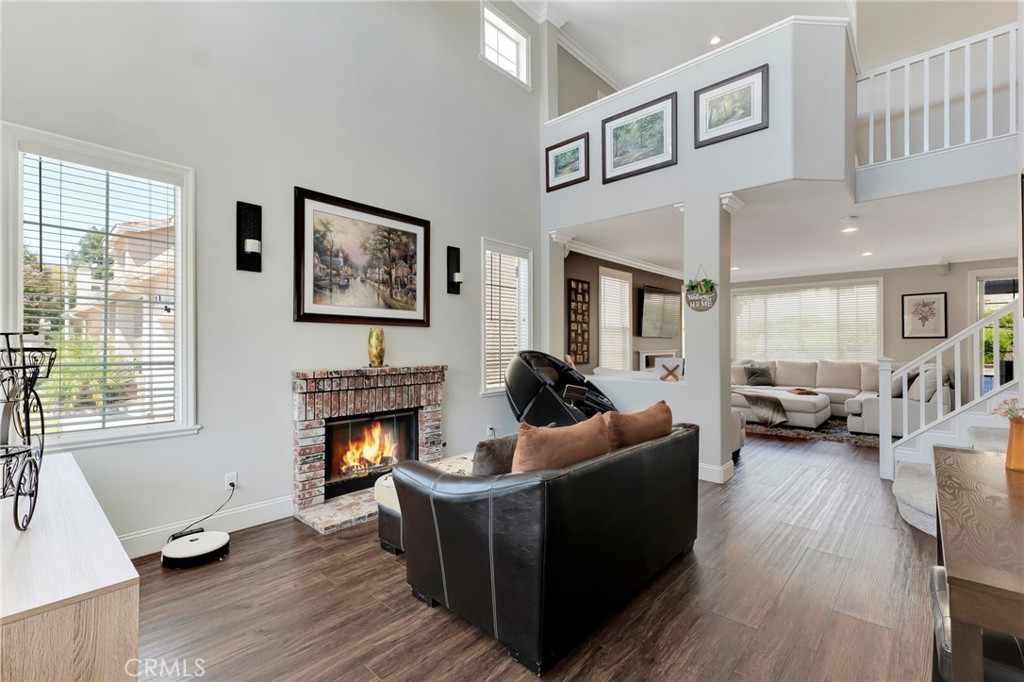 2702 Titania Place Simi Valley, CA 93063 - Photo 5 of 38 a living room with furniture two window and a fireplace