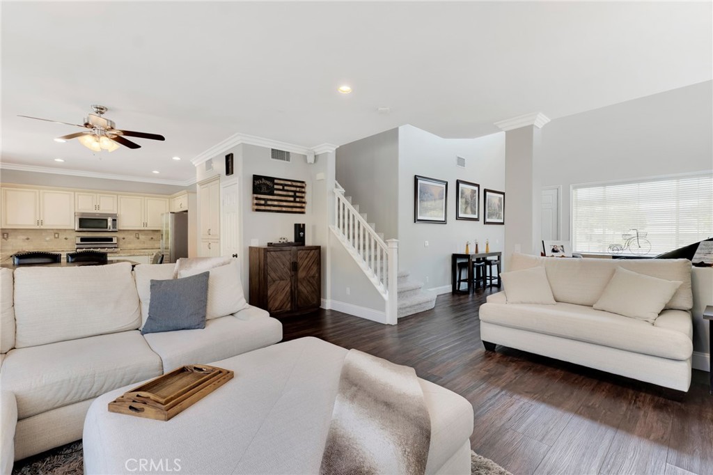2702 Titania Place Simi Valley, CA 93063 - Photo 6 of 38 a living room with furniture and a wooden floor