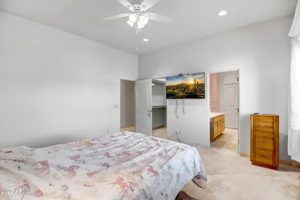 a bedroom with a bed and a view of bedroom